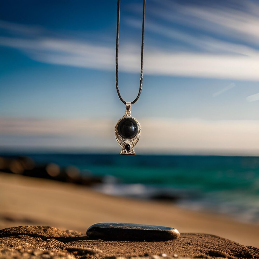 Black pendant on thong necklace  18 in.